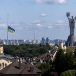 Ukrainian national flag flies at half-mast near the Ukrainian Motherland
