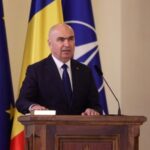 Romania’s Prime Minister Bolojan speaks during a swearing in ceremony