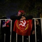 A supporter of the communist party looks on moments before