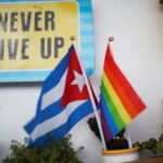 A Cuban flag and a Pride rainbow flag symbolising gay