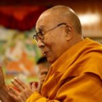 FILE PHOTO: Tibetan spiritual leader, the Dalai Lama, offers blessings