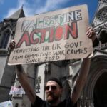 A supporter of pro-Palestinian campaign organization Palestine Action holds a