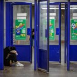 People take shelter inside a metro station during an air