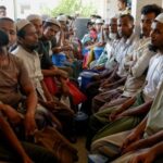 FILE PHOTO: Rohingya refugees wait at the World Food Programme(WFP)