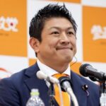 Japan’s Sanseito party leader Sohei Kamiya reacts as he speaks