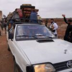 Bedouin families leave the village of Al-Mazraa