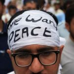 People rally to protest against the militant violence and demanding