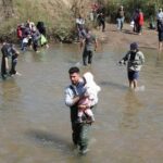 Alawite Syrians, who fled the violence in western Syria, walk