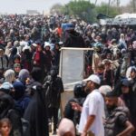Palestinians seek aid from the U.S.-backed Gaza Humanitarian Foundation, near