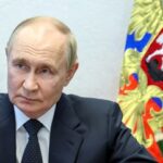 Russian President Vladimir Putin meets with VTB Bank President and