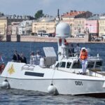 Russian President Putin is seen onboard a patrol boat on