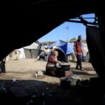 Displaced Palestinians who have not received humanitarian aid survive on