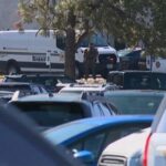A Washoe County Sheriff’s Deputy keeps watch outside the Grand