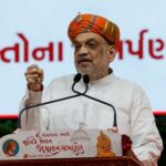 India’s Home Minister Amit Shah addresses devotees during an inauguration