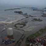 Tsunami waves flood an area after a powerful magnitude 8.8