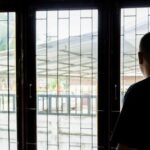 A Lao man, recently deported from the U.S., gazes out