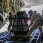 Royal Canadian Air Force CC-130 Hercules transport aircraft airdrops humanitarian