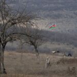 An Azeri soldier is seen at fighting positions near divided