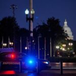 A law enforcement vehicle stands in front of Union Station