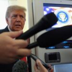 Trump speaks to reporters aboard Air Force One before meeting
