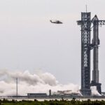 A SpaceX Starship spacecraft stands on the launch pad after
