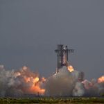 A SpaceX Super Heavy booster carrying the Starship spacecraft lifts