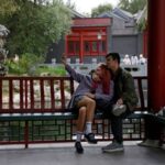 People take a selfie in the Chinese landscape park “Huaming”