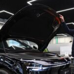A customer inspects the Zeekr 7X electric car at a