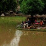 Monsoon rains and rising water levels in Patraki village, in