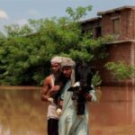 Monsoon rains and rising water levels in Qadirabad village near