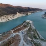 Aerial view of Kouris reservoir, where a once-submerged Church is