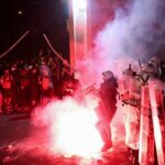 Anti-government protestors clash with riot police in Novi Sad