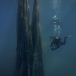 Volunteer divers remove tons of ghost nets smothering the Greek