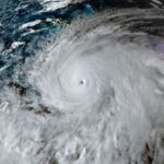 A satellite view shows Tropical Storm Melissa, over the Caribbean