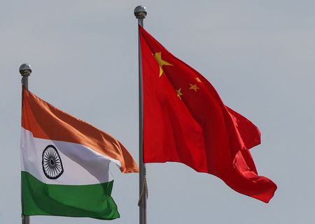 National flags of China and India fly next to the