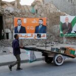 Campaign posters ahead of Iraqi parliamentary election, in Mosul