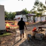 Avishay Edri, 41, walks on a path near the home