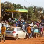 People gather at a petrol station in Bamako, Mali