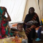 Injured displaced Sudanese fleeing violence in al-Fashir and receiving treatment