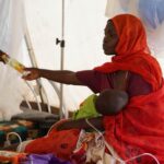 Injured displaced Sudanese fleeing violence in al-Fashir and receiving treatment