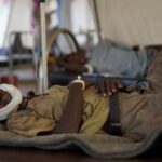 Injured displaced Sudanese fleeing violence in al-Fashir and receiving treatment