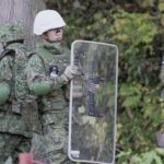 A member of Japan Self-Defense Forces (JSDF) holds a shield