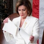 FILE PHOTO: Speaker of the House Pelosi (D-CA) rips up