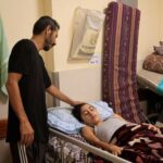 An Injured Palestinian boy Mohammed Helles, who suffered from a