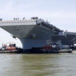 FILE PHOTO: Pre-Commissioning Unit Gerald R. Ford is maneuvered by