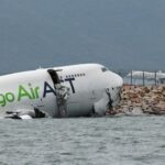 A cargo plane skids off the runway during landing at