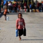 Palestinians gather to collect water, Gaza City