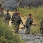 FILE PHOTO: Fighters with the Kurdistan Workers’ Party (PKK) walk