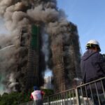Flames engulf bamboo scaffolding across multiple buildings at Wang Fuk