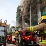 Flames engulf bamboo scaffolding across multiple buildings at Wang Fuk